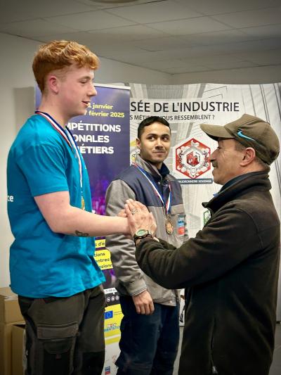 médaillé et son formateur